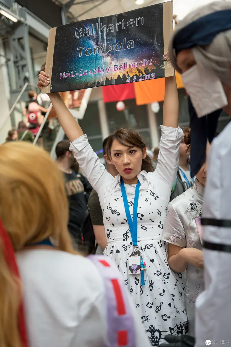 AniNite 2018: Passionate Protester Holding Rally Sign with Raised Arms