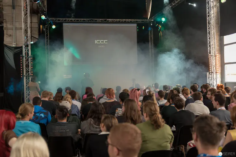 ICCC Conference Presentation: Audience Gathered in Atmospheric Smoke-Filled Venue