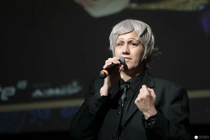Intense Vocalist Performing on Stage at AniNite 2018 Music Event