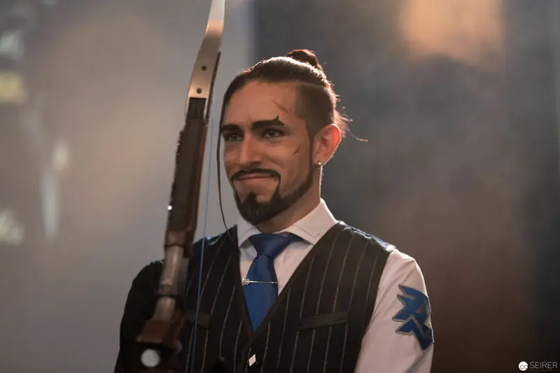 Formally Attired Performer with Bow at Dimly Lit Event