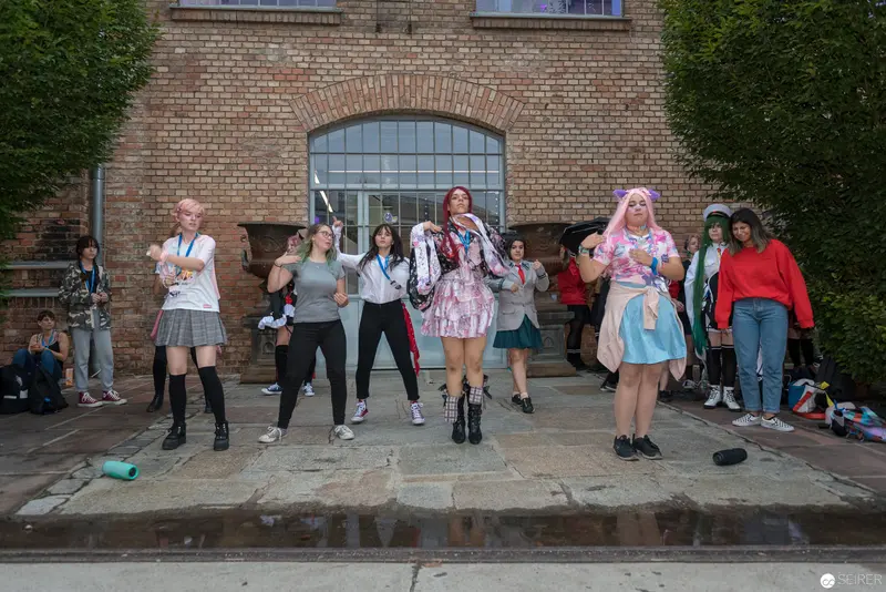 AniNite 2018: Group of Cosplayers Posing Outside Brick Building