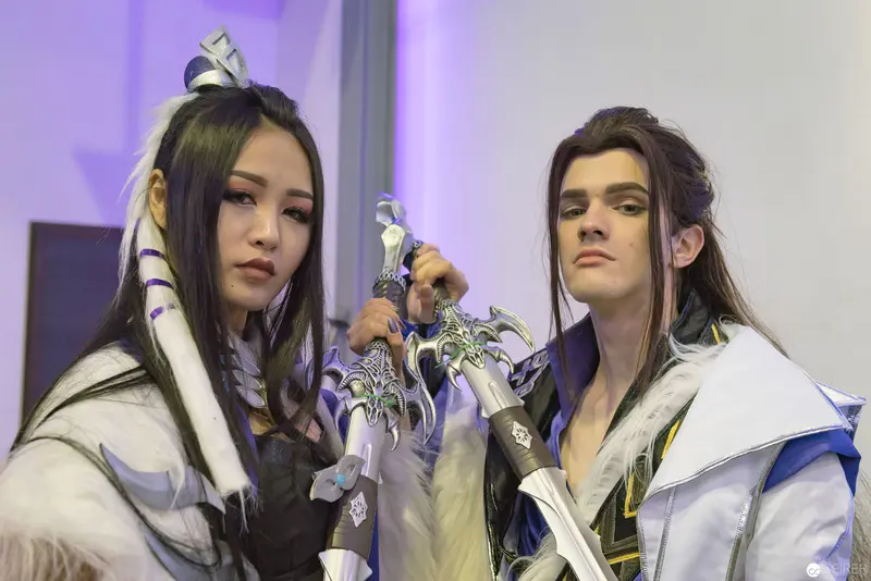 Costumed Performers in Ethereal Purple Lighting at AniNite 2018 Convention