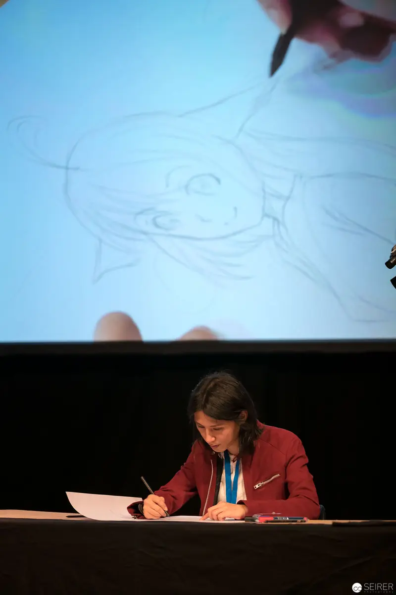 AniNite 2018: Performer in Red Jacket Sketching Projected Artwork