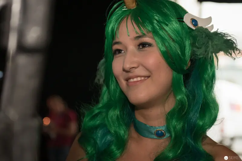 Green-Haired Cosplayer Smiling at AniNite 2018 Anime Convention