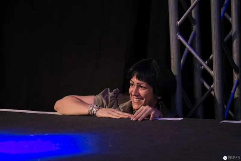 Performer Leaning Joyfully on Stage at AniNite 2018 Event