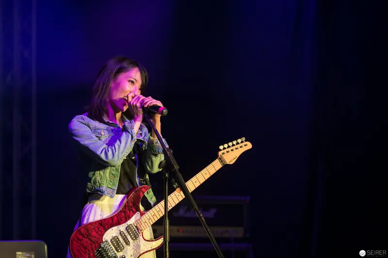 Haruka Performing Live at AniNite 2018 with Electric Guitar and Microphone
