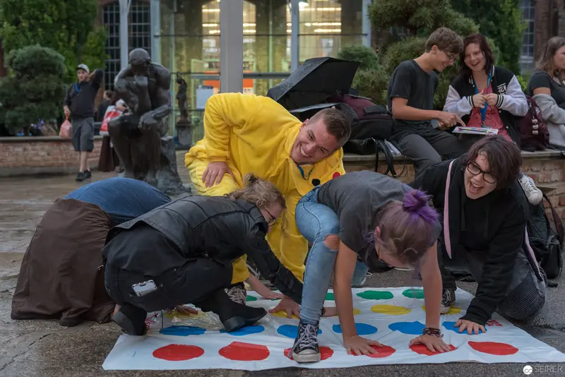 Playful Urban Twister Game During Outdoor Community Event