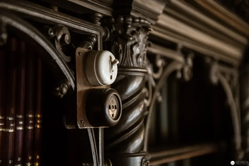 Vintage Electrical Switch on Ornate Architectural Metalwork