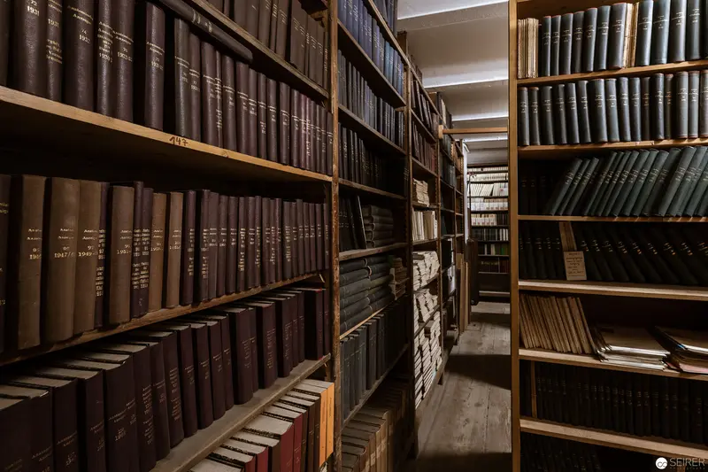 Archival Stacks: Detailed View of Densely Packed Historical Book Collection