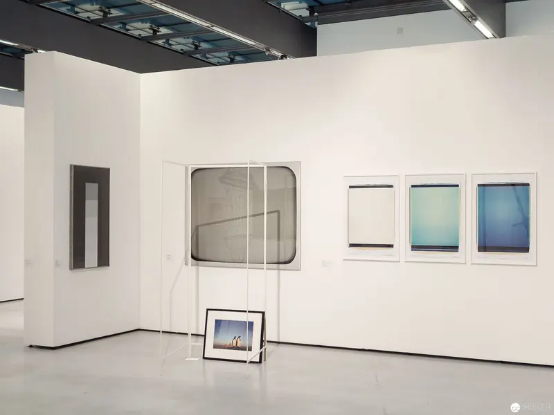 Minimalist Gallery Interior with Framed Photographic Artworks at MUSA Vienna