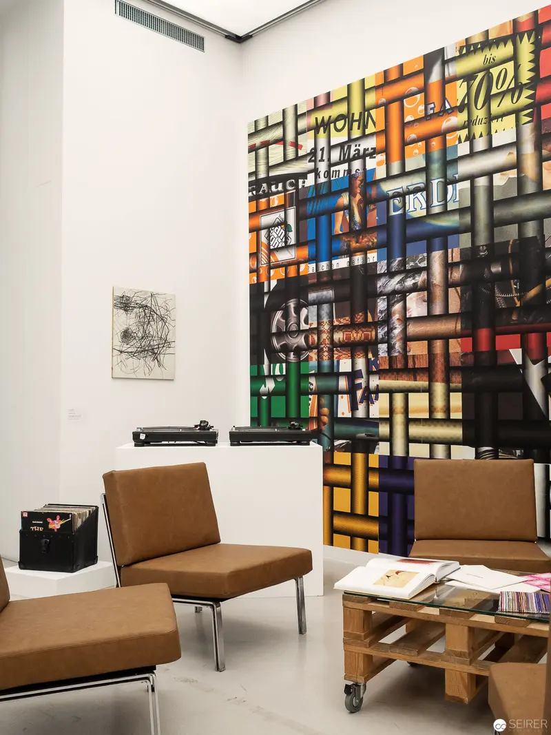 "Contemporary Art Installation with Geometric Painting and Modernist Furniture Design"