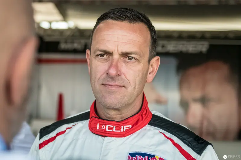 Red Bull Air Race Pilot in Professional Racing Attire at Pit Facility