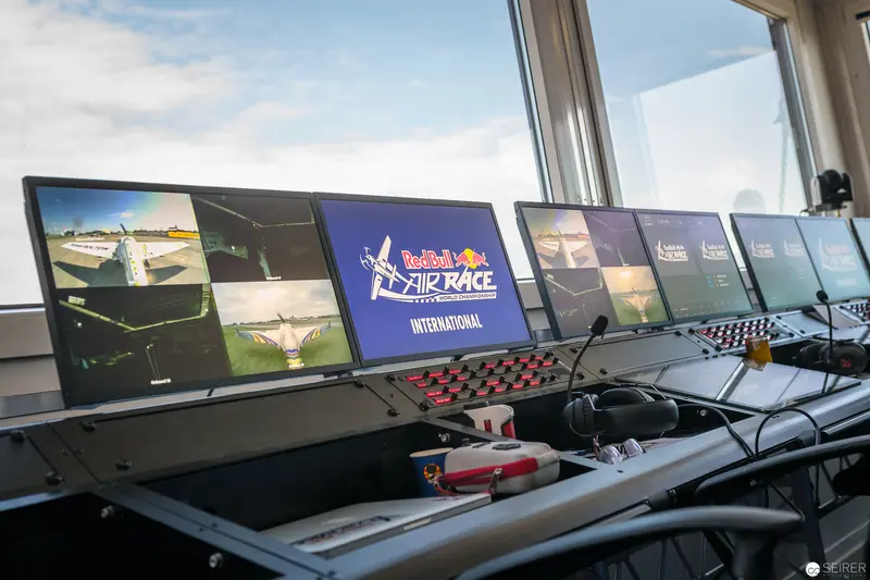 Red Bull Air Race International Control Room Monitoring Multiple Flight Screens