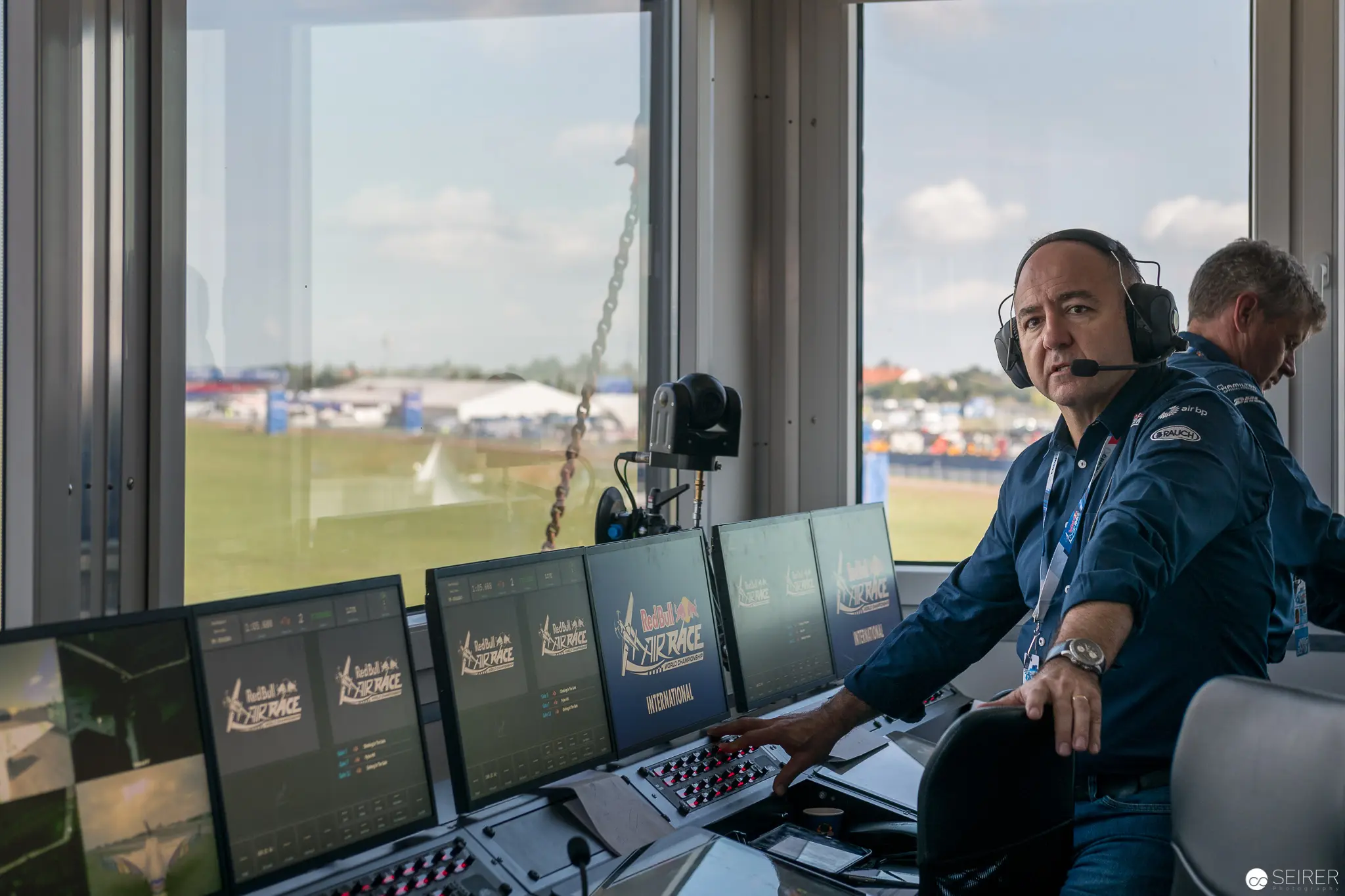 Red Bull Air Race Control Tower: Operator Monitoring Competition Screens