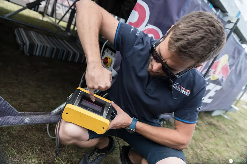 Red Bull Air Race Technician Calibrating Precision Measurement Equipment Onsite