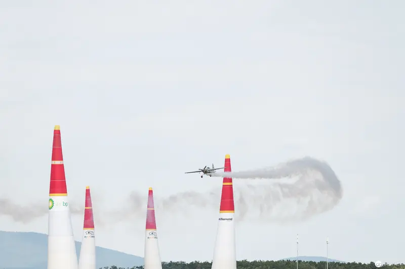 Red Bull Air Race: Precision Aircraft Navigating Crimson Pylons in Aerial Challenge