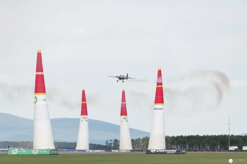 Red Bull Air Race Plane Navigating Precisely Between Iconic Pylons