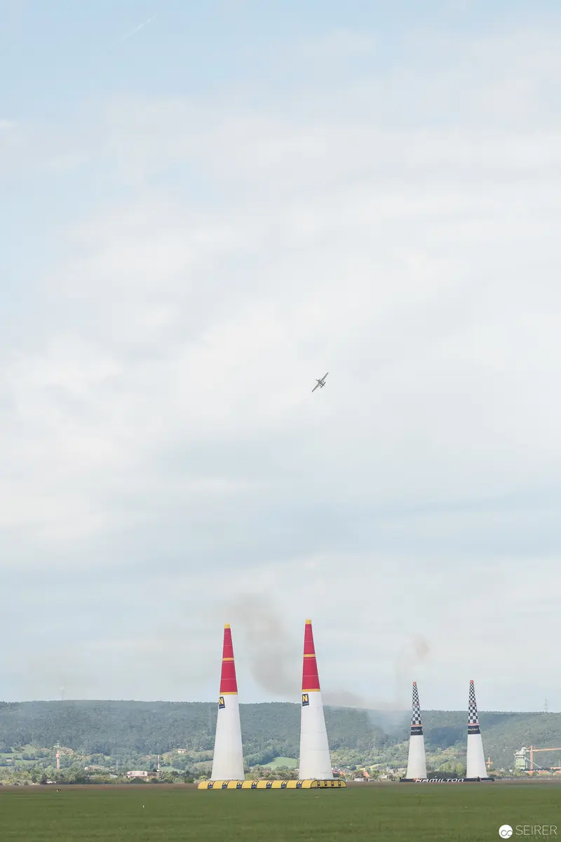 Red Bull Air Race: Precision Pylons and Aircraft Against Expansive Landscape