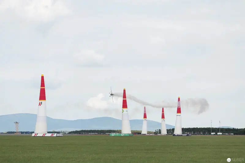 Red Bull Air Race: Precision Aircraft Navigating Vertical Pylons in Landscape Setting