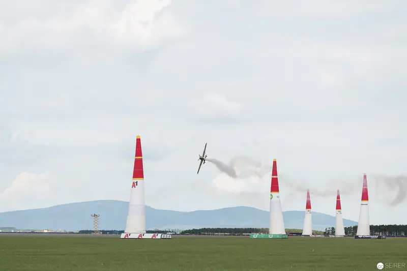Red Bull Air Race: Precision Aircraft Navigating Iconic White and Red Pylons