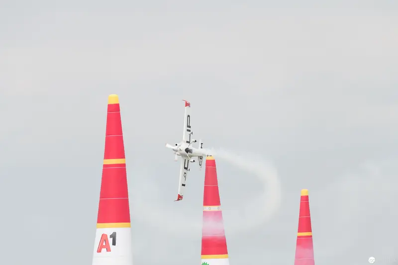 Red Bull Air Race Plane Navigating Precisely Between Red Marker Pylons