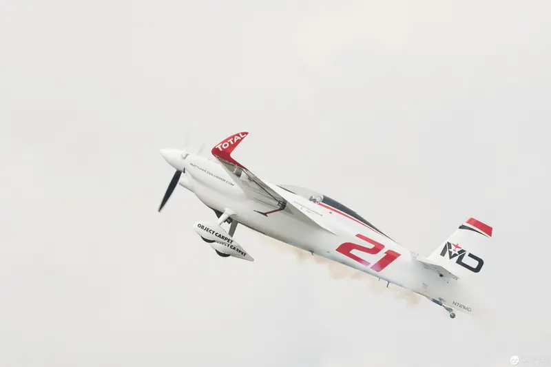 Red Bull Air Race Aerobatic Aircraft in Dramatic White and Red Precision Flight
