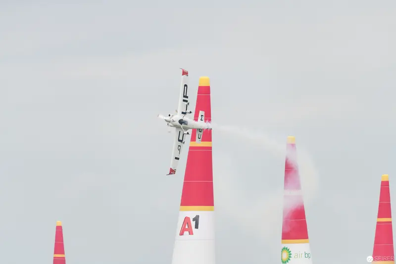 Red Bull Air Race: Precision Aircraft Maneuvering Between Crimson Pylons