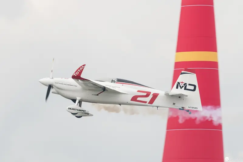 Red Bull Air Race Competitor's Precision Flight Past Crimson Pylon