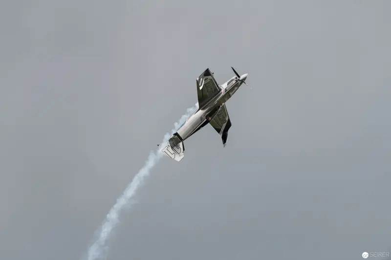 Red Bull Air Race Stunt Plane Executing Dramatic Mid-Air Vertical Maneuver
