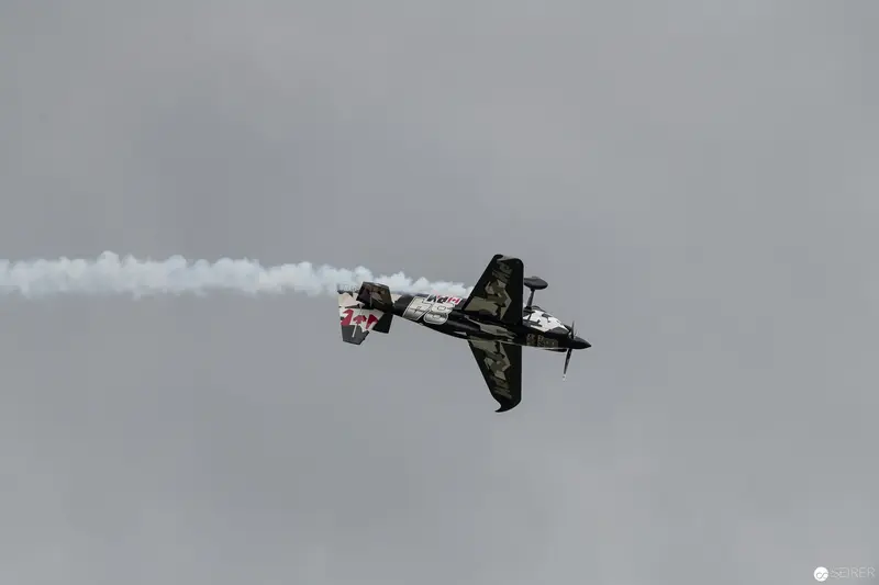 Red Bull Air Race Aerobatic Plane Executing Dramatic Mid-Air Maneuver