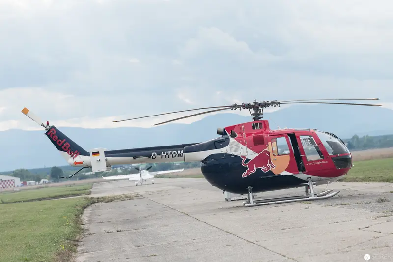 Red Bull Air Race Helicopter Staged on Concrete Airfield Runway