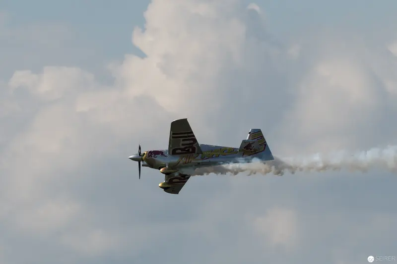 Red Bull Air Race Aerobatic Aircraft Performing Dramatic Skyward Maneuver