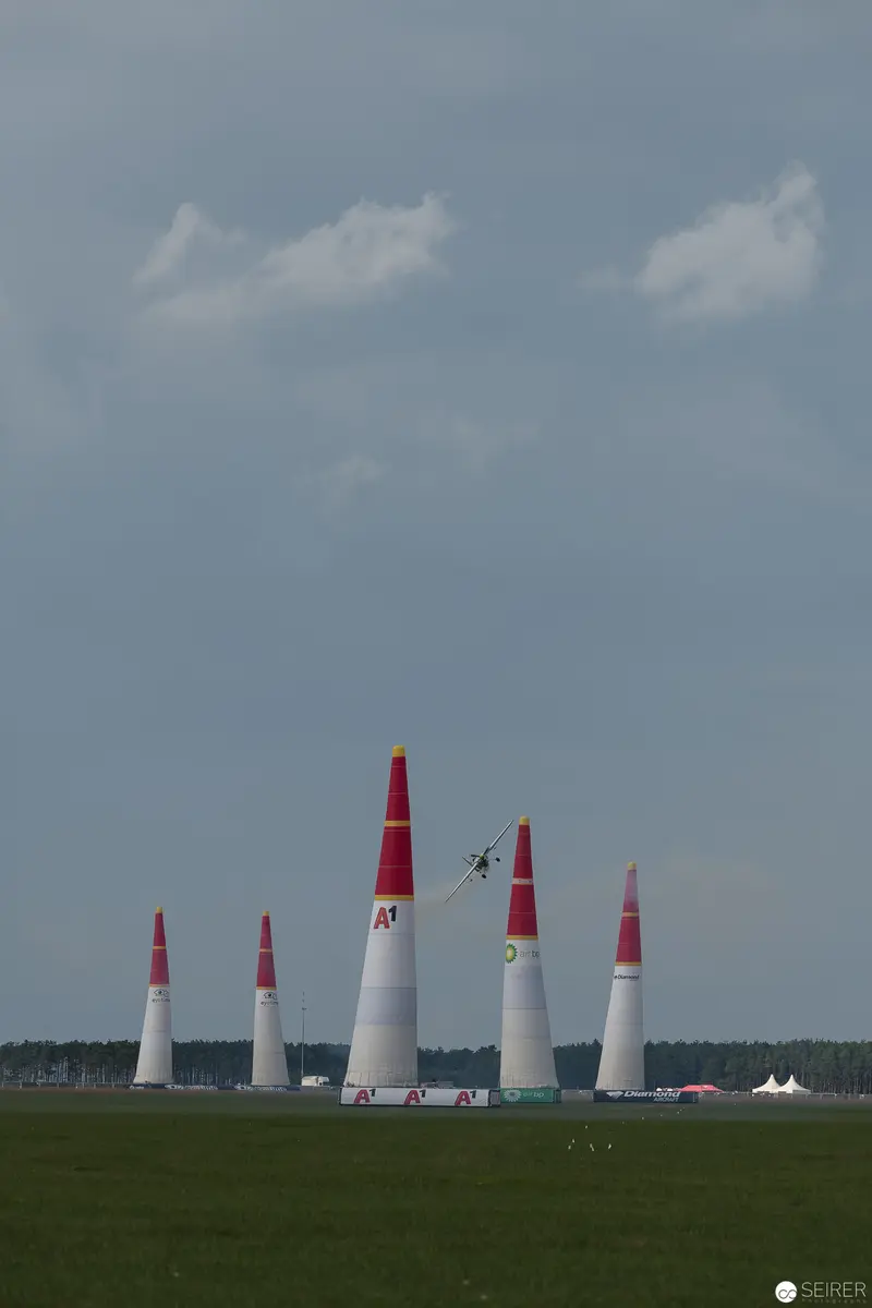 Red Bull Air Race: Precision Pylons and Aerial Performance Against Overcast Sky