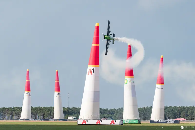 Red Bull Air Race Precision Pilot Navigating Tall Marker Pylons in Flight