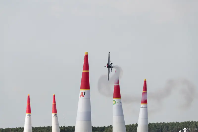 Red Bull Air Race Pylons with Aircraft Navigating Precise Aerial Course
