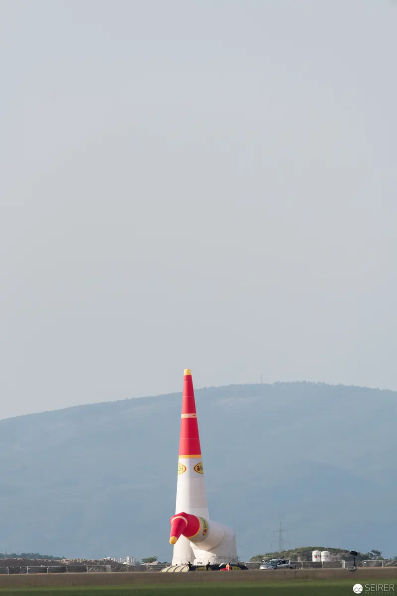 Red Bull Air Race Pylon Standing Tall Against Mountain Landscape