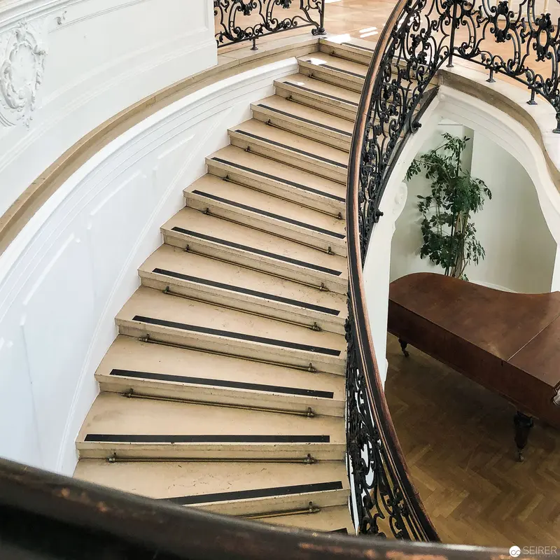 Elegant Curved Staircase with Ornate Wrought Iron Balustrade at Open House Vienna 2018