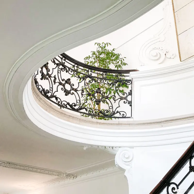 Ornate Staircase with Wrought-Iron Railing and Verdant Foliage at Open House Vienna 2018