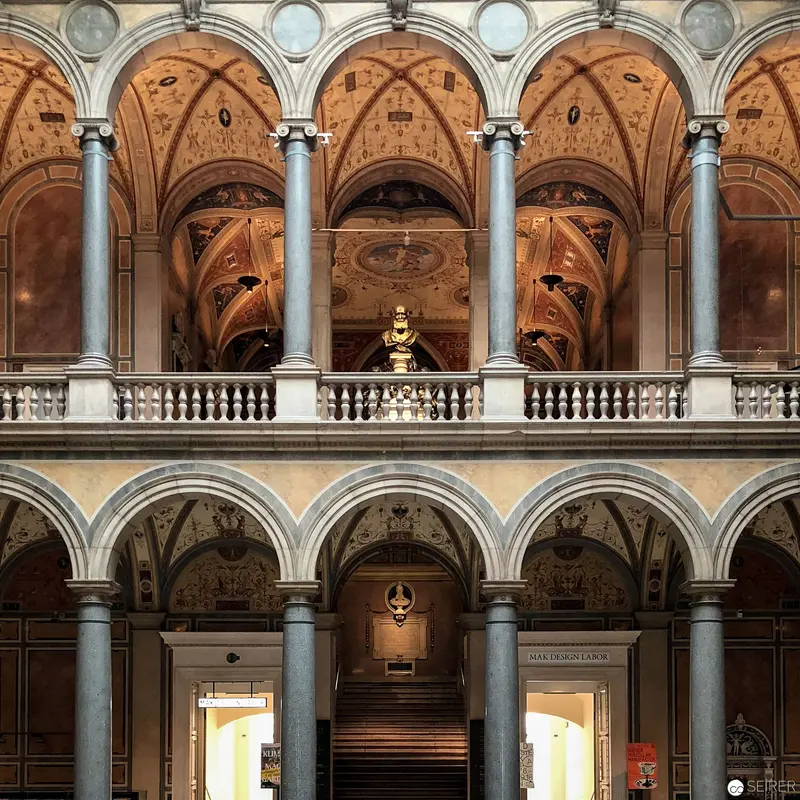 Architectural Splendor of Ornate Interior with Arched Columns and Balustrades