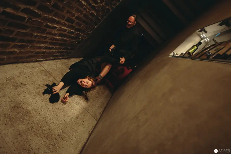 Nesterval Theatre Performance "Das Dorf": Dramatic Encounter in Shadowed Architectural Space