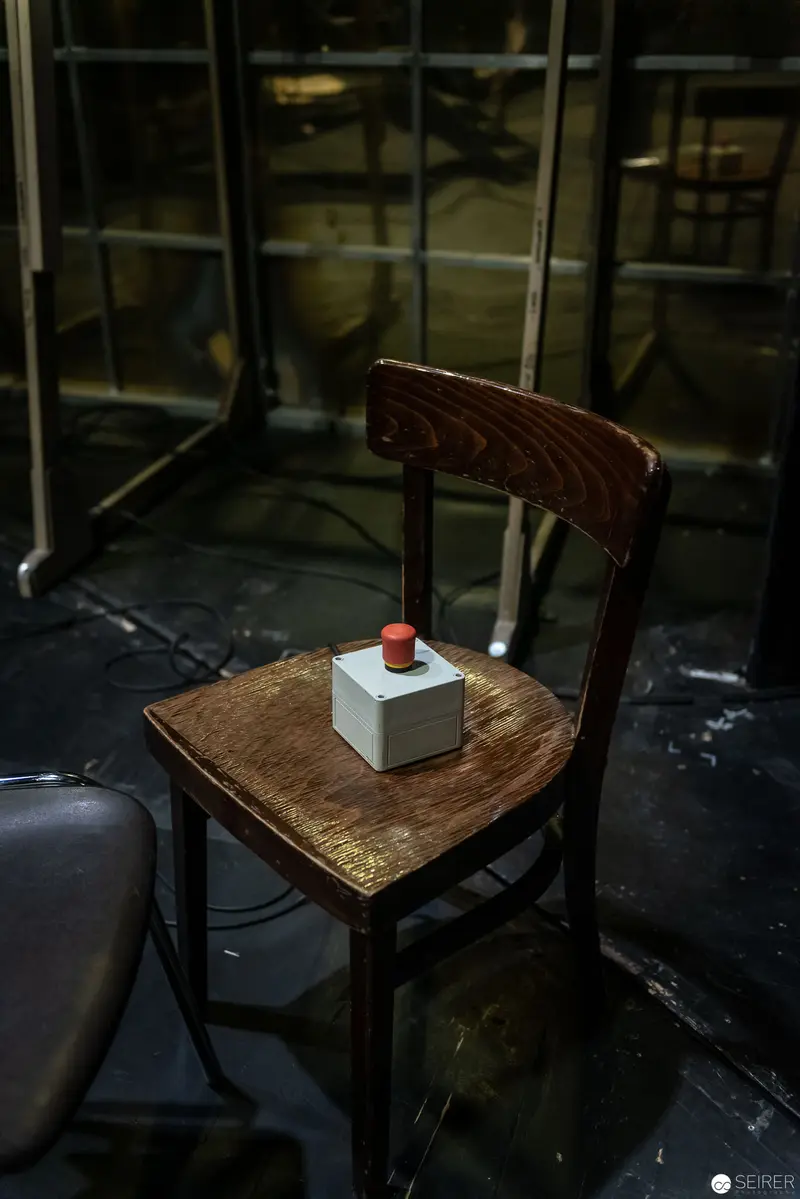 Minimalist Still Life with Cube and Wooden Chair in Industrial Setting