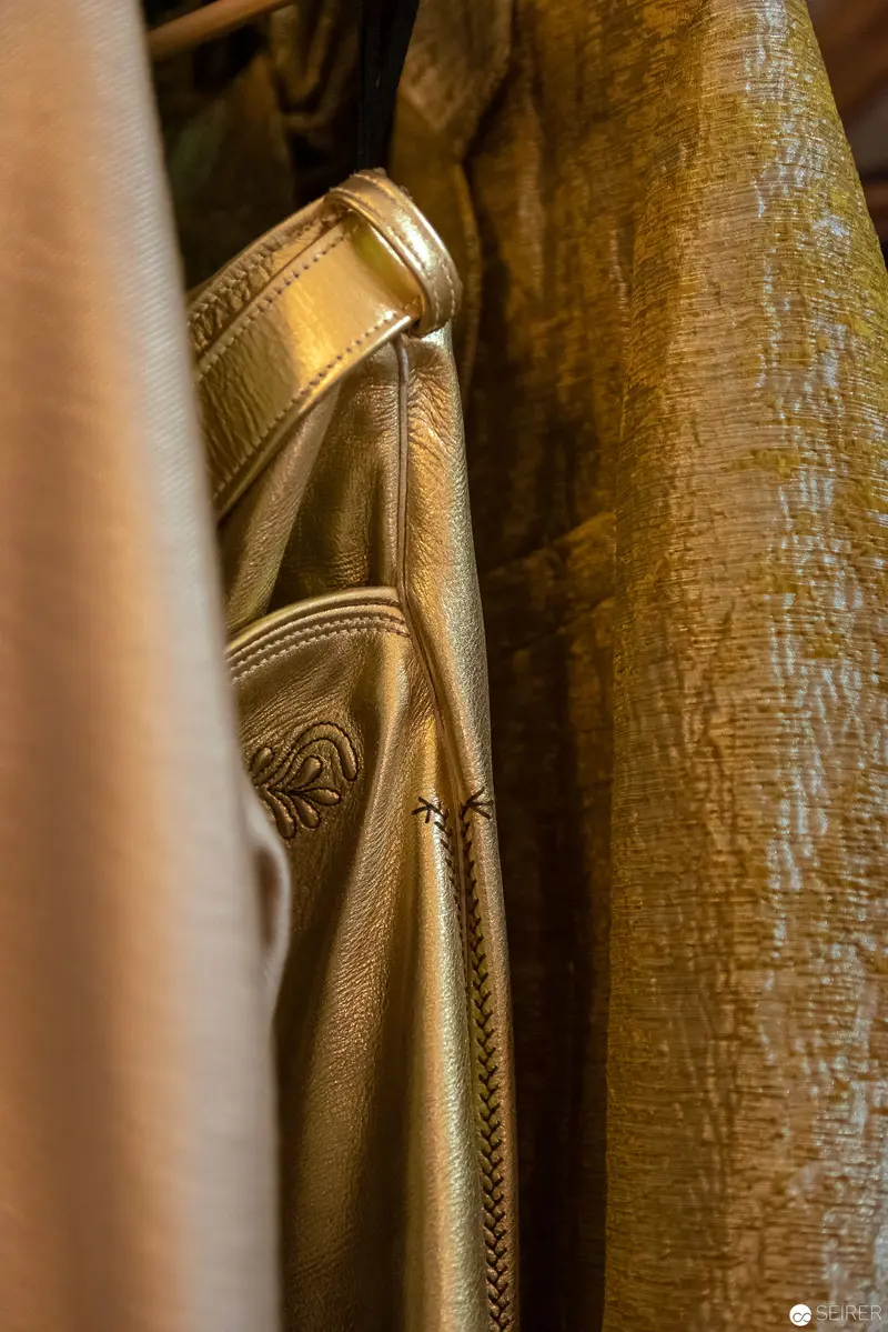 Golden Fabric Study: Draped Textural Composition in Warm Metallic Tones