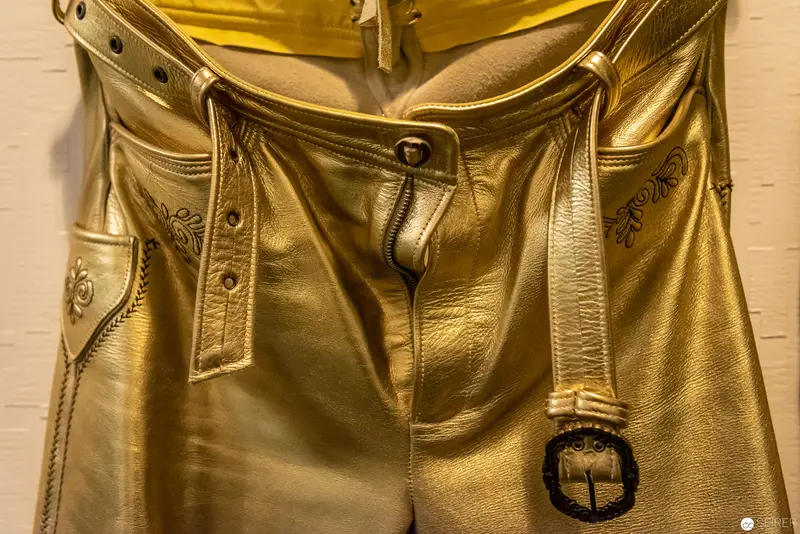 Gold Leather Garment with Decorative Metallic Detailing and Embellished Buckle