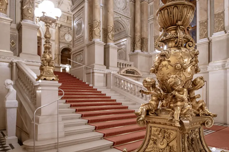 Grand Baroque Staircase with Ornate Gold Fixtures in Palatial Interior