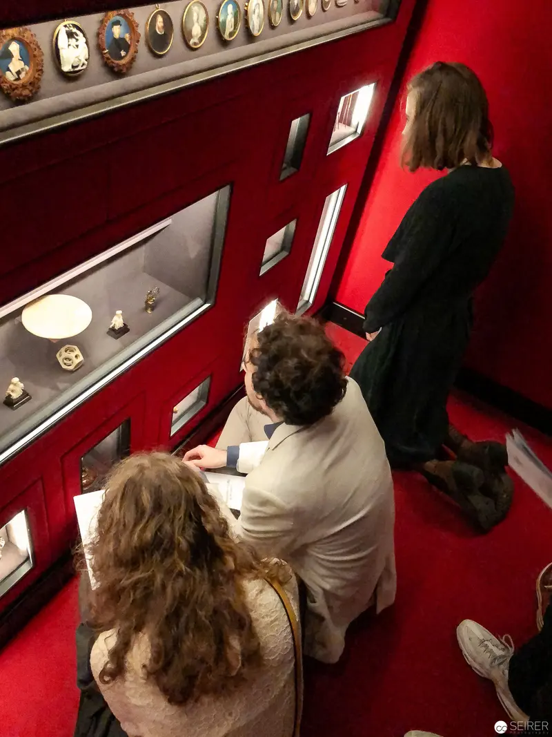 Museum Viewers Examining Historical Displays at Kunsthistorisches Museum Wien