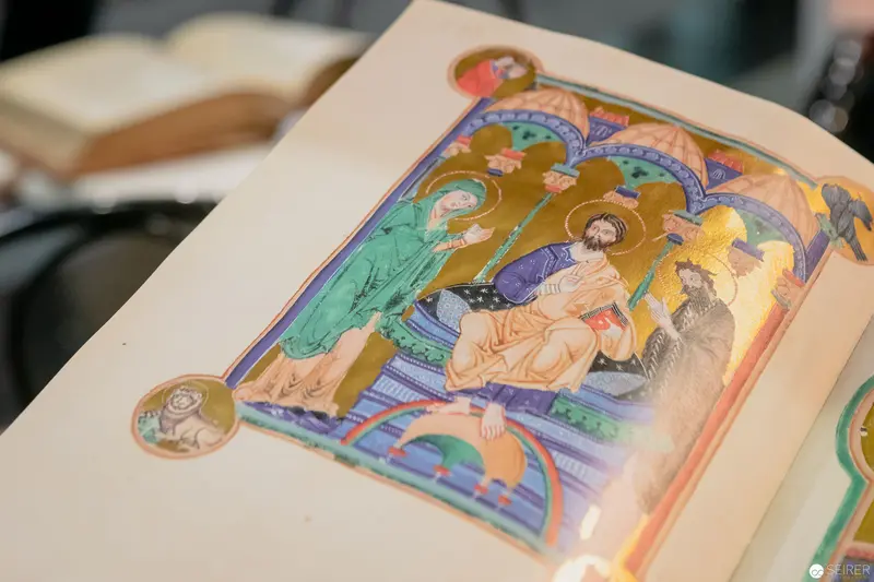 Medieval Illuminated Manuscript Page with Religious Figures in Ornate Architectural Frame