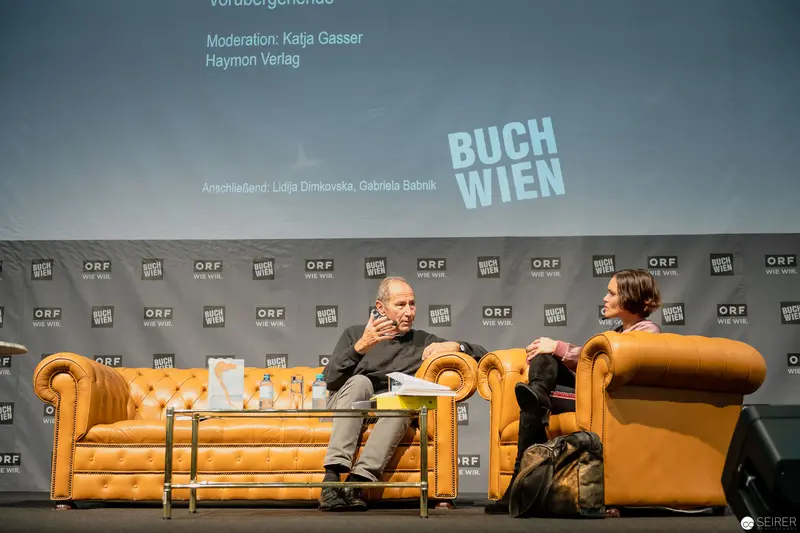 Buch Wien Literary Event: Two Speakers on Yellow Chesterfield Sofas