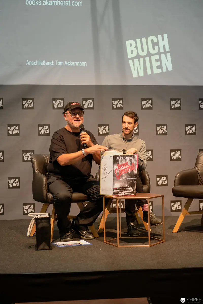 Buch Wien Author Panel: Two Speakers Discussing Literature at Cultural Event