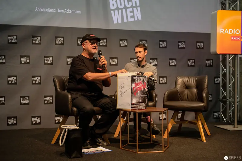 Buch Wien Literary Event with Tom Ackermann and Unidentified Speaker