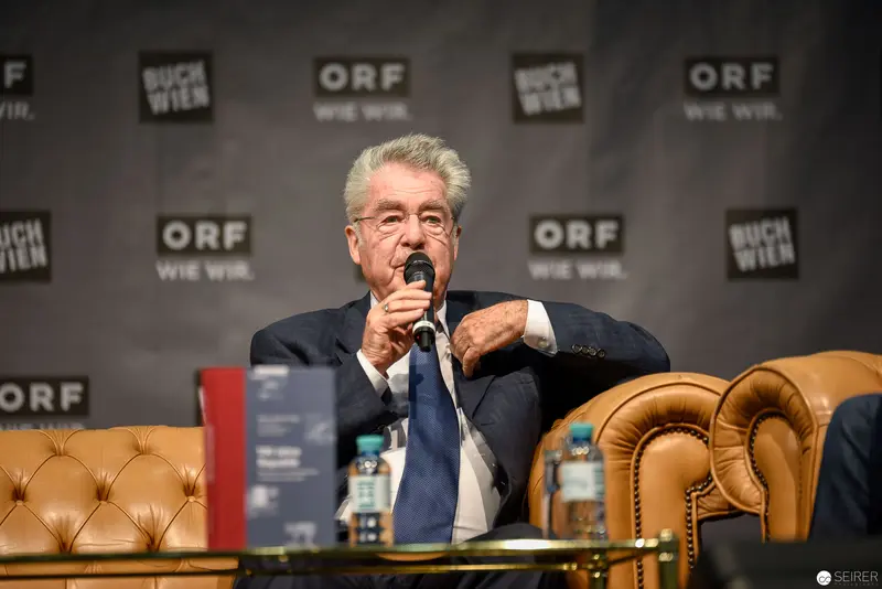 Heinz Fischer Speaking at ORF Event with Leather Armchair Backdrop